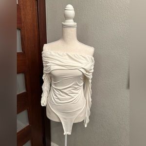 White Karen Millen bodysuit.